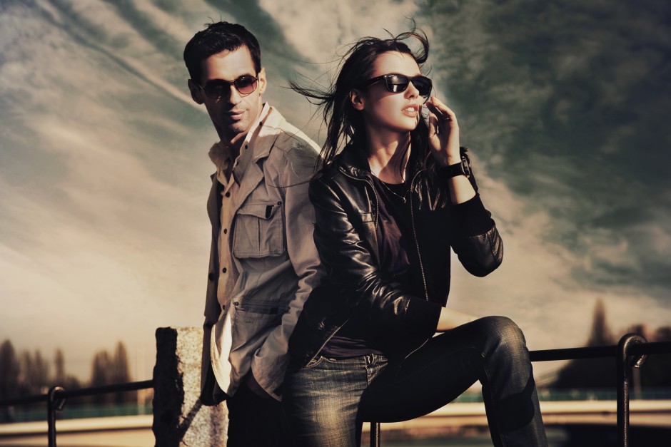 Attractive young couple wearing sunglasses